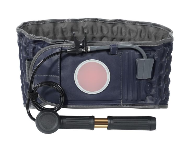 M102R pneumatic traction lumbar belt in navy, its air columns and hook-and-loop closure visible, with the long gold-barrel hand pump and hose below it on a white background.